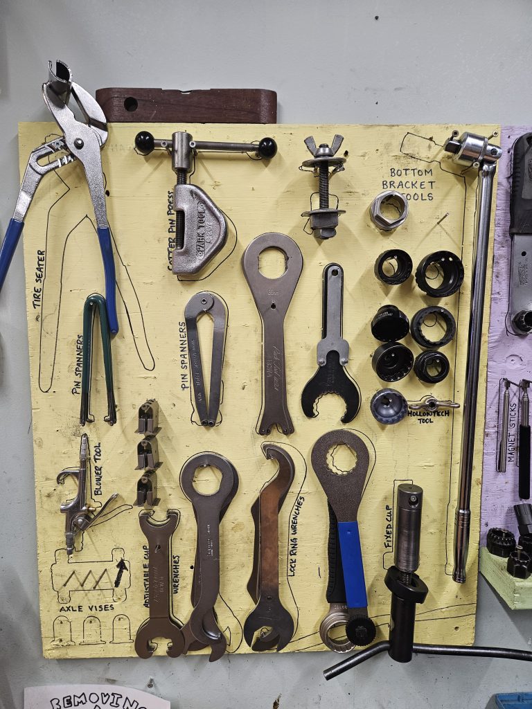 These are the shared bottom bracket tools. There are pin spanners, cup wrenches and extractor devices to wrestle out tough parts.